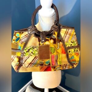 Multi-colored FOSSIL hand bag.